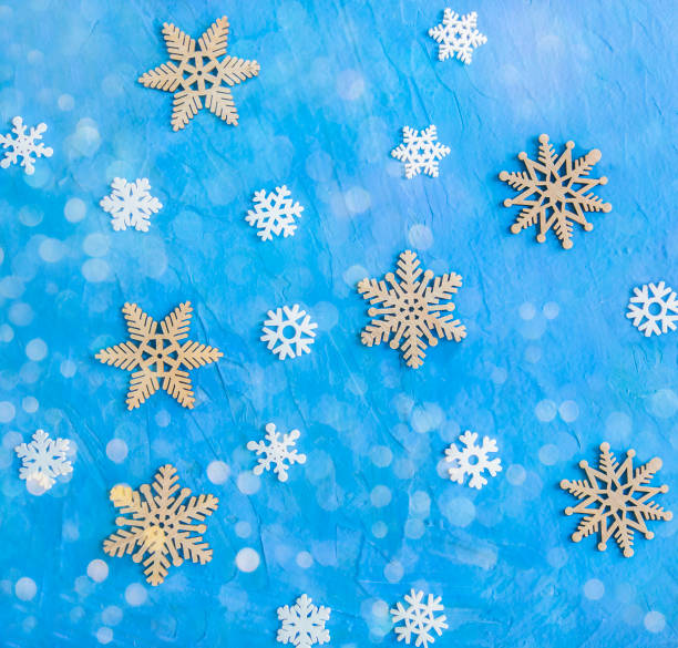 istock Patern of artificial snowflakes on a blue background 1341682477