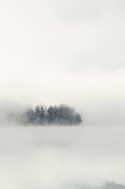 istock Swedish lake in fog 01 1341683594