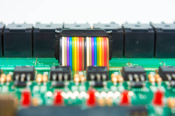 Ribbon cable on circuit board stock photo.