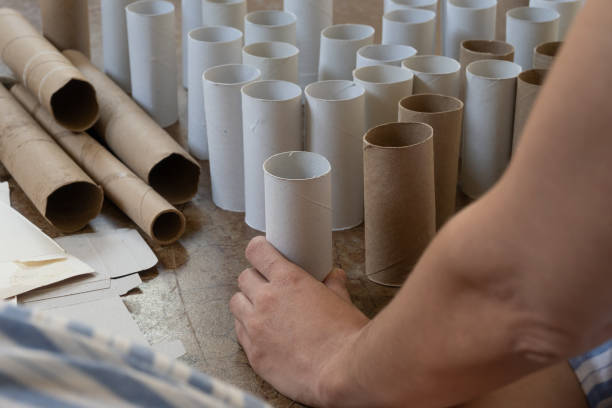istock Woman separating cardboard, recycling concept 1341685640