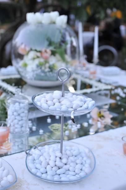 istock Wedding table with favors and confetti. 1341686336