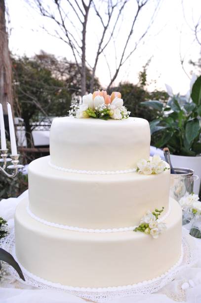 istock Wedding cake on the table ready for cutting by the newlyweds. 1341686340