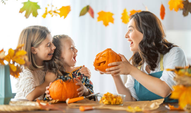 istock family preparing for Halloween 1341686610