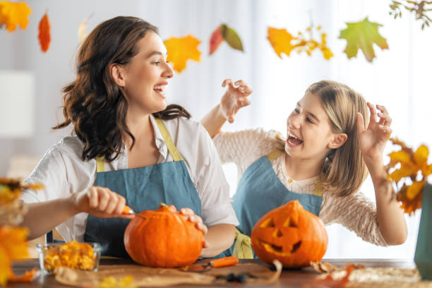 istock family preparing for Halloween 1341686666