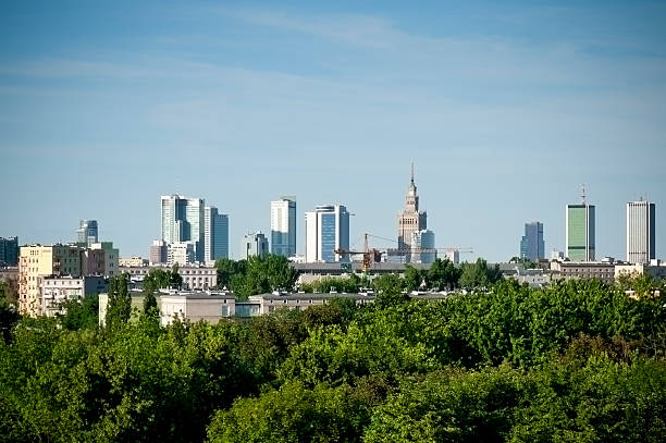 Panorama of Warsaw in Poland, view with green park on first.