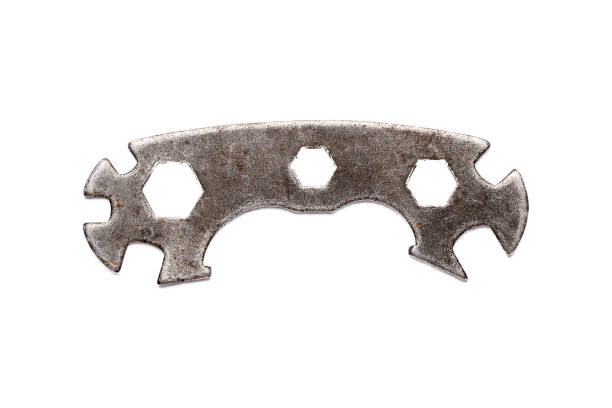 Wrench. Old multifunctional wrench on a white background. Isolate on white. Bicycle repair kit.