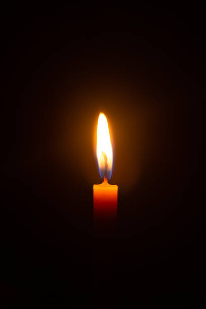 istock candles on a black background,Candle, Flame, Fire - Natural Phenomenon, Copy Space, Candlelight,Candle, Single Object, Burning, Flame, Zen-like 1341691867