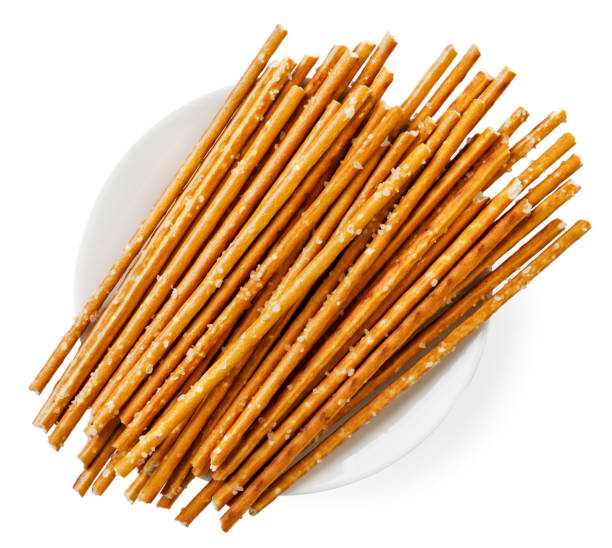 istock Crispy salted straw in a plate on a white background, isolated. Top view 1341691938