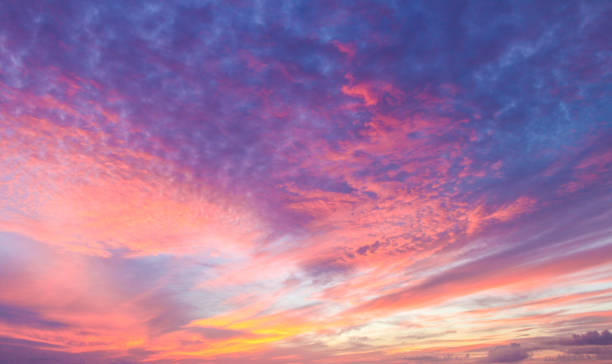 istock Flaming beautiful sunset background or replacement sky with pinks and organges and yellow and purple 1341692066