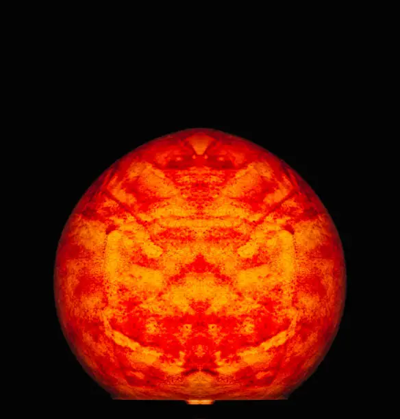Photo of red glowing surrealistic easter egg macro fantasy,black background