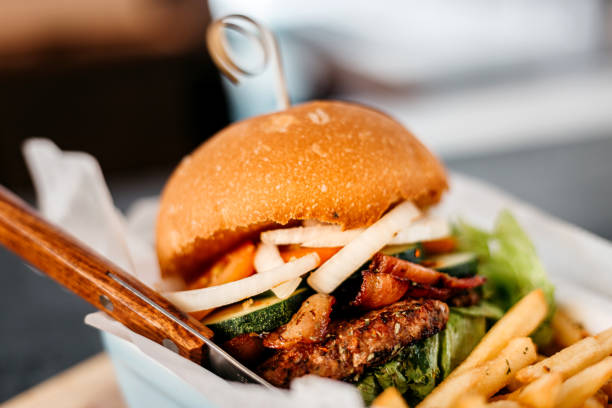 istock Extra Beef Burger on white plate french fries 1341694001