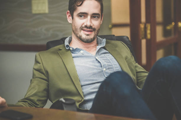 istock Cocksure businessman in an office confident and cool attitude 1341695665