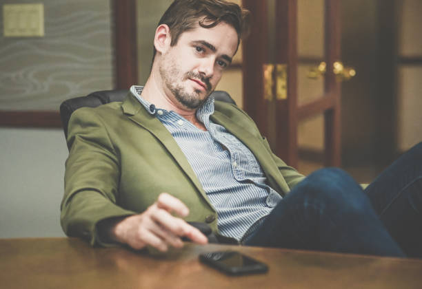 istock Cocksure businessman in an office confident and cool attitude 1341695674
