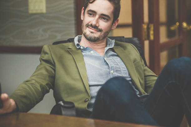istock Cocksure businessman in an office confident and cool attitude 1341695770