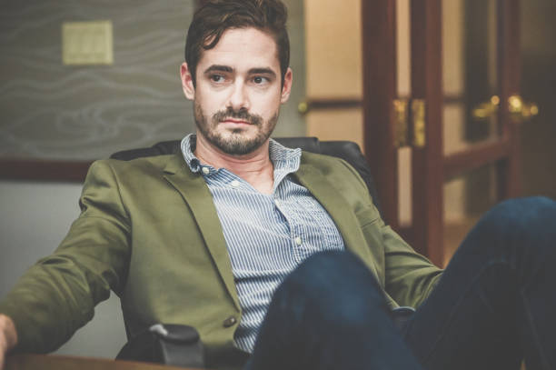 istock Cocksure businessman in an office confident and cool attitude 1341695814