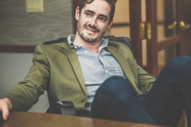 istock Cocksure businessman in an office confident and cool attitude 1341695824
