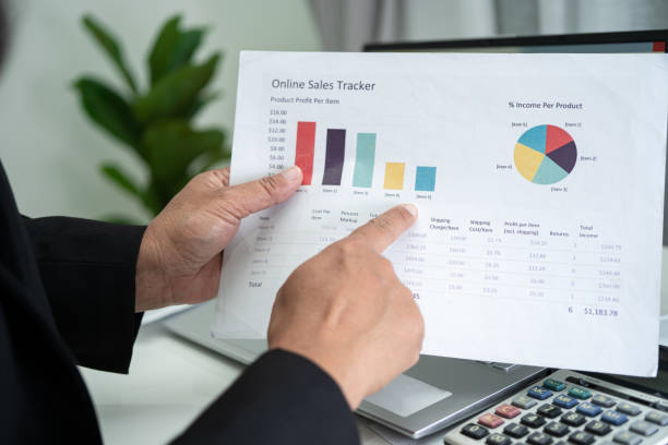 istock Asian accountant working and analyzing financial reports project accounting with chart graph in modern office, finance and business concept. 1341695883