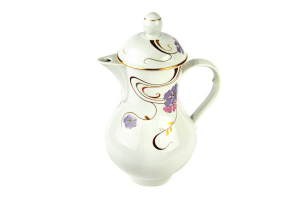 istock Vintage porcelain coffee pot isolated on white background. 1341696871