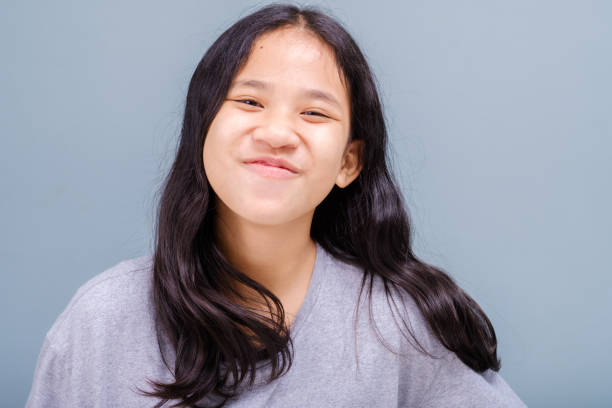 istock Girl Smile Without Showing Teeth 1341698026