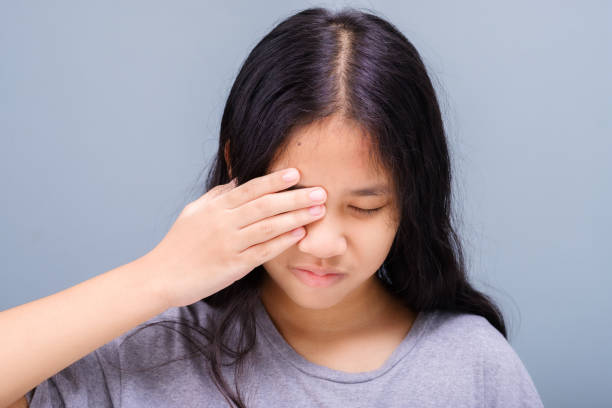 Girl Suffer From Eye Irritation stock photo