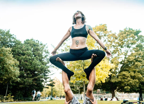 istock Two People practising Acro Yoga in the park 1341698339