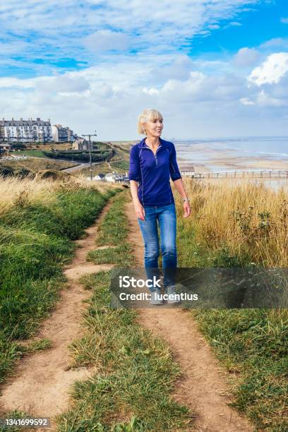 Cleveland Way Footpath Above Saltburn England Stock Photo - Download Image Now - 50-59 Years, 60-69 Years, Active Lifestyle