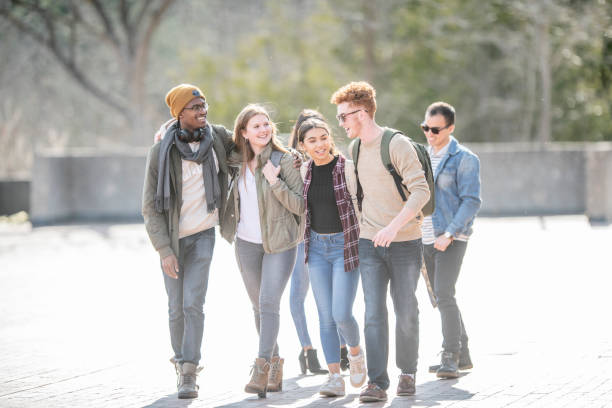 istock Friends Walking Around The University Campus 1341700831