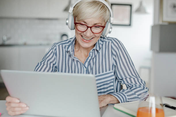 istock Senior woman is working from home 1341703322