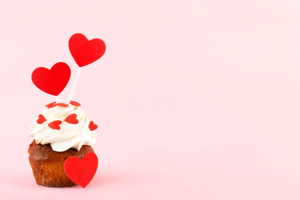 istock cupcake with hearts on a pink background, place for text, Valentine's day 1341704905