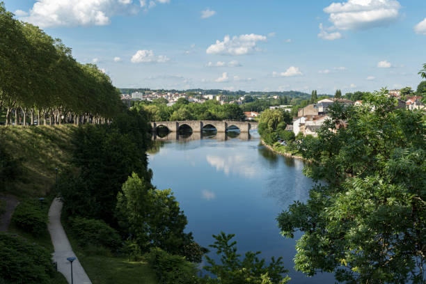 Saint Etienne Bridge in Limoges City with clouds reflection Saint Etienne Bridge in Limoges City with clouds reflection saint étienne photos stock pictures, royalty-free photos & images