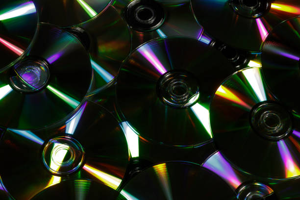 istock Pile of CDs lit with lighting equipment 1341707243