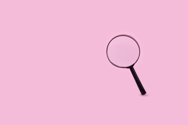 istock Magnifying glass on pastel pink background. Minimal creative search concept. 1341708086
