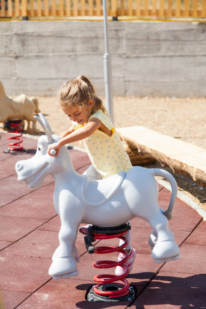 istock Little Girl Swinging 1341709016