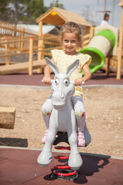 istock Little Girl Swinging 1341709122