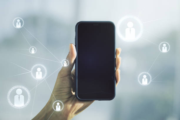 istock Social network media concept and hand with mobile phone on background. Double exposure 1341709367