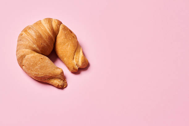istock Moon shaped traditional french croissant on isolated background with copy space. Horizontal photo. Top view angle. Food and healthy concepts. 1341711021
