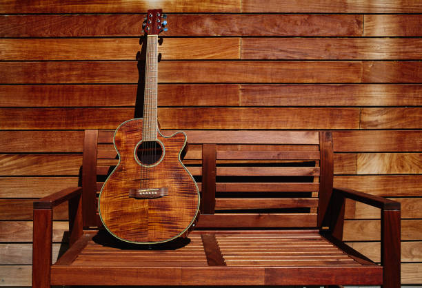 acoustic brown guitar in wooden stripes - spanish culture audio imagens e fotografias de stock