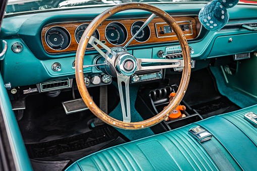 Virginia City, NV - July 31, 2021: Dashboard and Steering Wheel in a 1965 Pontiac Tempest seen  at a local car show.