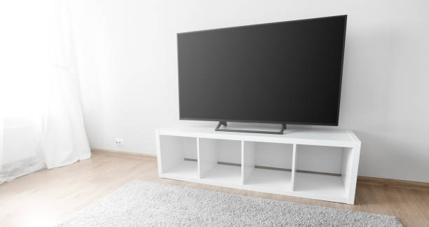 istock Lcd tv on white shef at modern room interior 1341714593