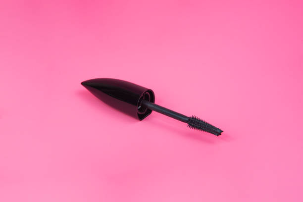 istock Black tube mascara for lashes make up on pink background 1341716235