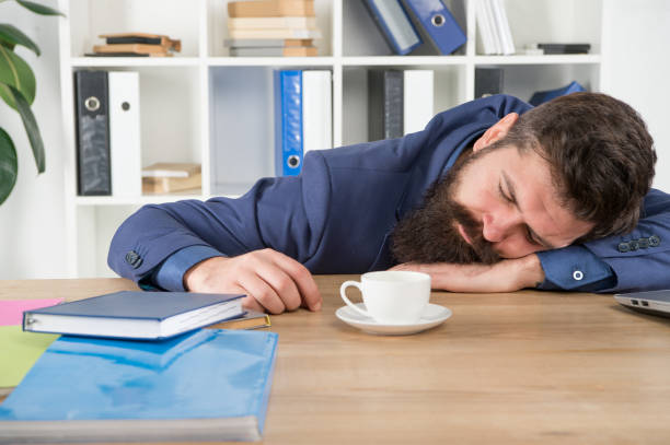 istock Procrastination is thief of time. Man handsome boss sleep in office drinking coffee. Hard morning. Bearded hipster formal suit relaxing with coffee. Office life. First coffee. Sleepless night 1341717006