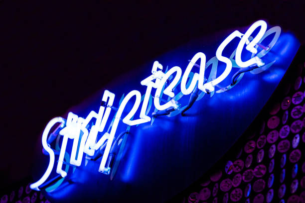 istock Blue neon sign of striptease 1341717211
