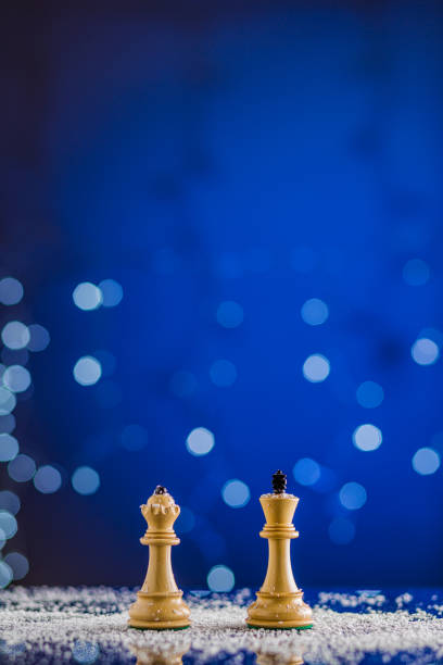 istock chessboard and chess pieces in a christmas or newyear postcard. strategy, intelligence board game 1341717418