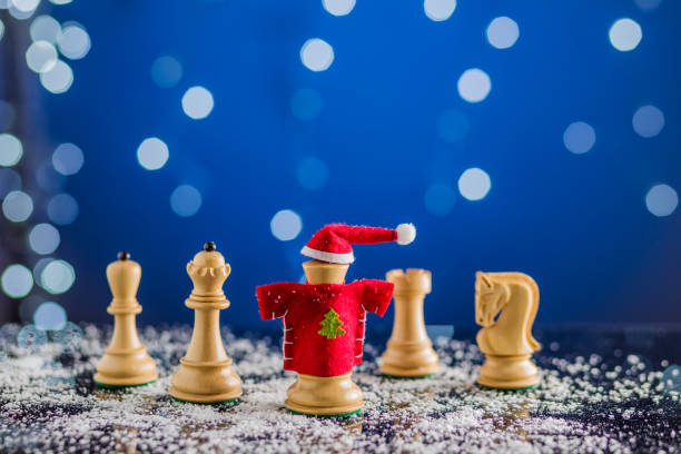 Santa Claus christmas or newyear leadership plan and intelligence concept. Chess board game stock photo