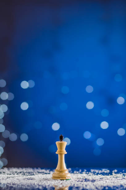 istock chessboard and chess pieces in a christmas or newyear postcard. strategy, intelligence board game 1341717451