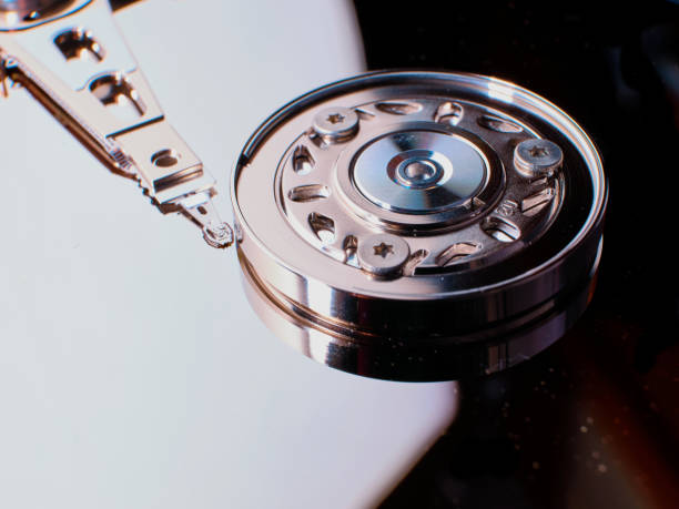 close up of open hard disc drive (hd) with platters, spindle, actuator and read, write head, electronic hardware component for computer - open harddisk flash imagens e fotografias de stock