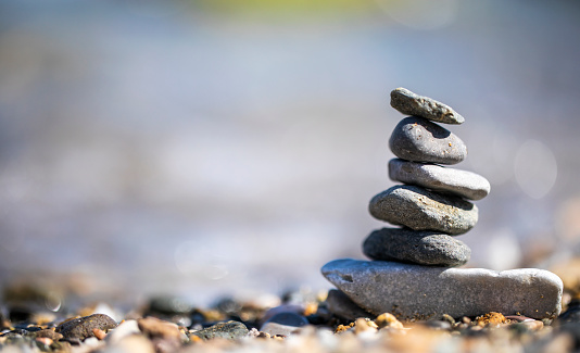 Made of stone tower on the beach and blur background