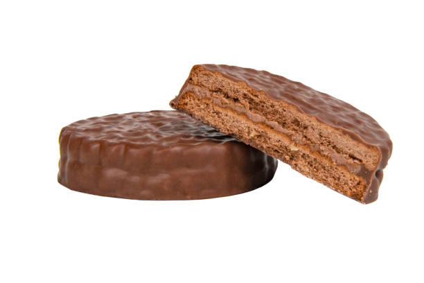 istock Brown chocolate sandwich cookies isolated on the white background 1341723036