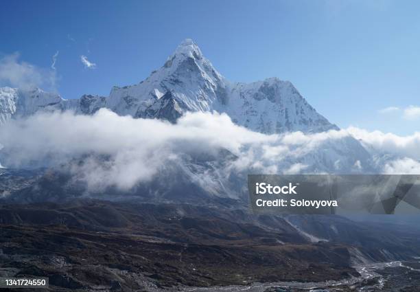 Ama Dablam 6814m Clouds Covered Peak View Near Dingboche Settlement In Sagarmatha National Park Nepal Everest Base Camp Trekking Route Stock Photo - Download Image Now