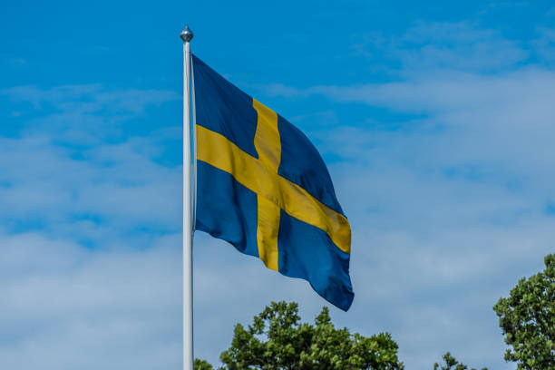 istock Swedish flag flying from a flag pole.. 1341727811